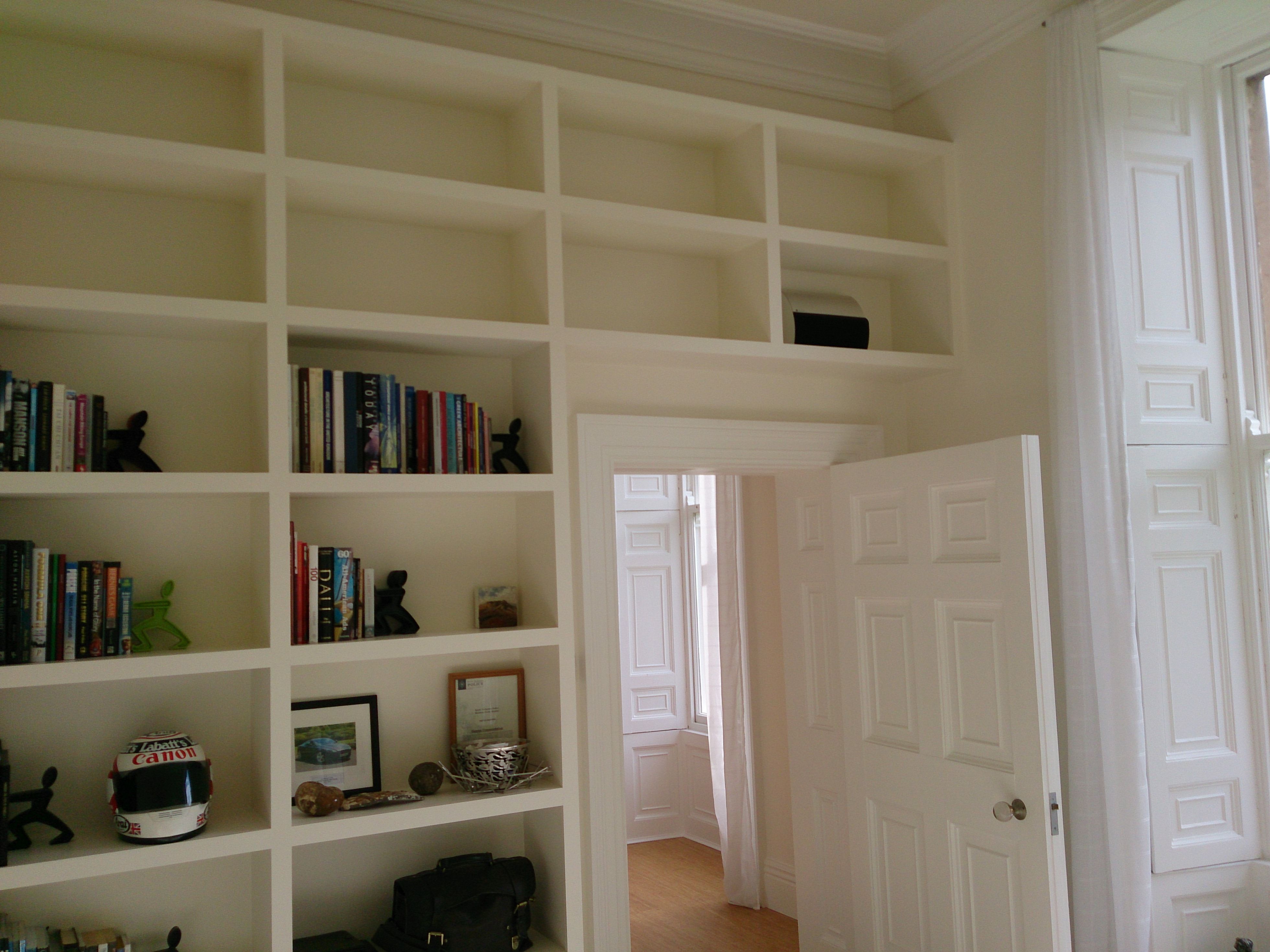 Fitted shelving construction